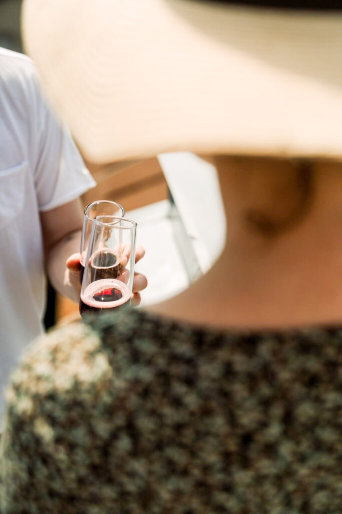 Man and woman sharing a bottle of Lambrusco